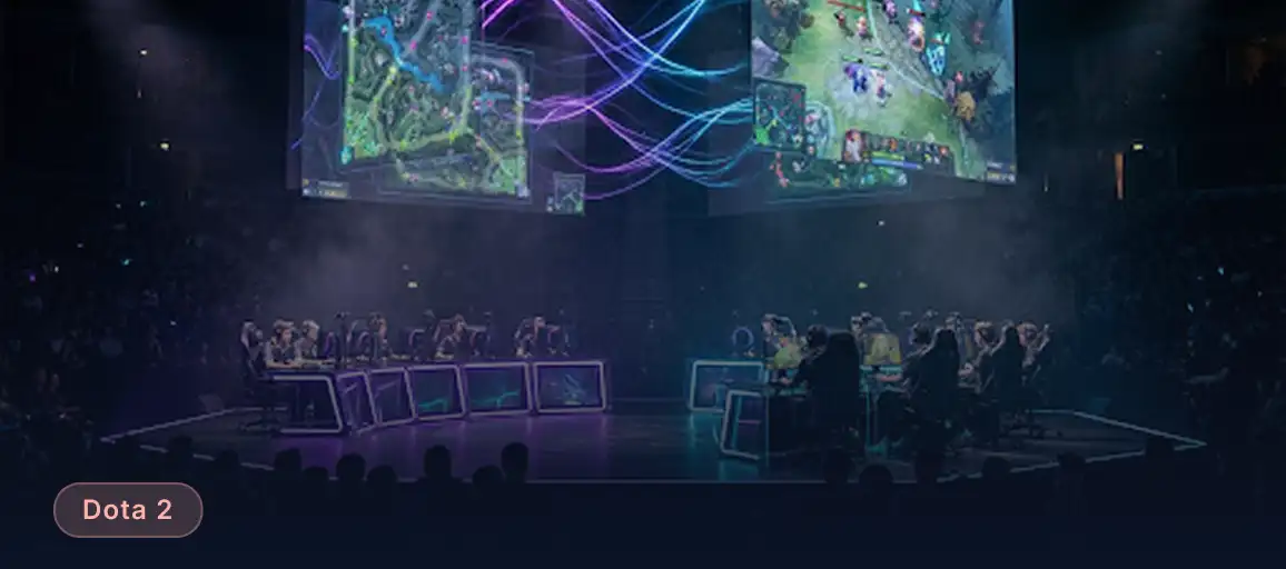 Profesjonalne rozgrywki e-sportowe Dota 2 na ciemnej scenie z podświetlanymi stanowiskami drużyn i ekranami pokazującymi mapę gry.